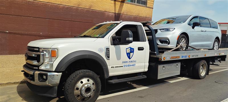 SWRS Towing flatbed with a Chrysler Pacifica minivan